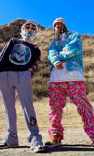 Tyga wearing 99%IS hat