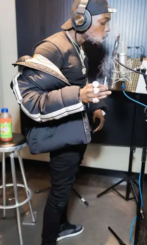 Bobby Shmurda wearing Louis Vuitton cap