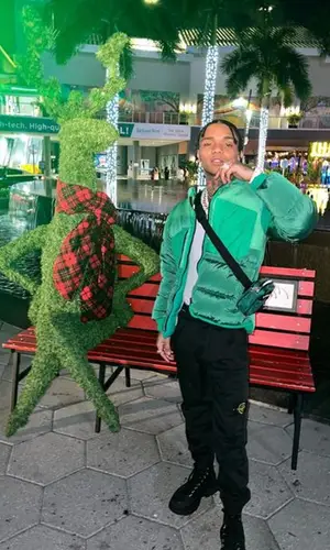 Swae Lee wearing Alexander McQueen boots