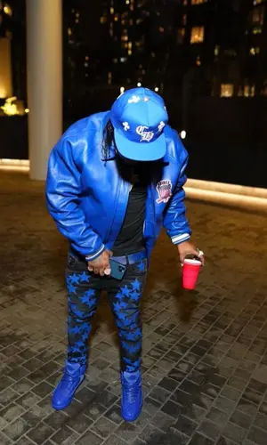 Rowdy Rebel’s Outfit in Avirex Jacket, Louis Vuitton Belt & Chrome Hearts Cap (2022)