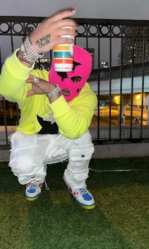 No Cap wearing Palm Angels sweatshirt