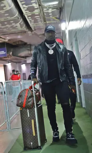 Deebo Samuel wearing Louis Vuitton bag