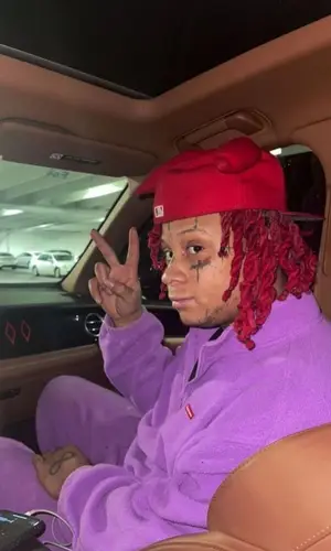 Trippie Redd’s Outfit in Supreme Jacket & Shyne Boys Hat (2022)