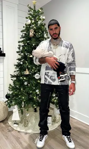 CJ’s Outfit in Off-White Sweater, Givenchy Jeans & Nike Sneakers (2022)