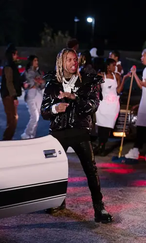 Lil Durk wearing Louis Vuitton boots