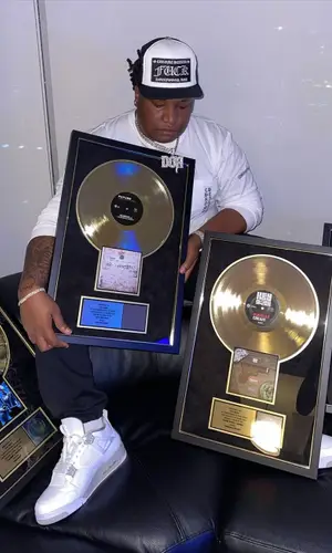 Tay Keith wearing Chrome Hearts pants