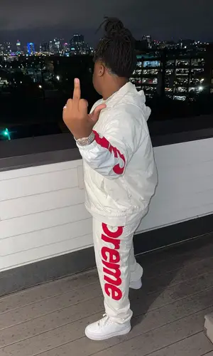 Tay Keith wearing Supreme pants