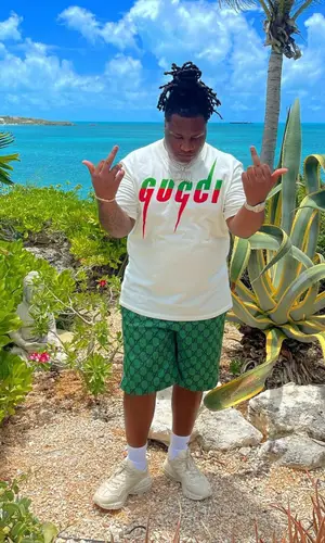 Tay Keith wearing Gucci t-shirt