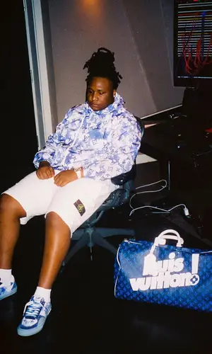 Tay Keith wearing Louis Vuitton bag