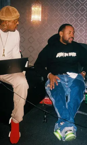 Mike Will Made-It wearing New Era cap