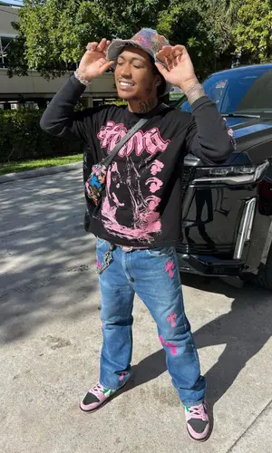 Lil Meech wearing Chrome Hearts bag