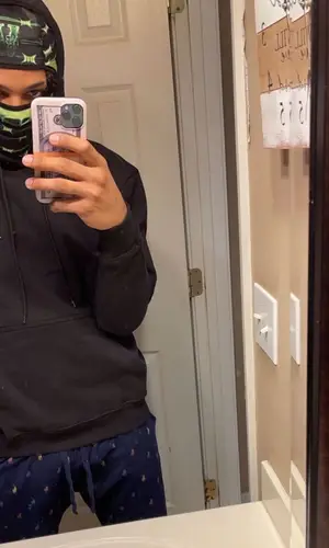 Mikey wearing Vlone hat