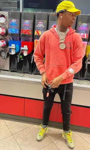 Big Scarr wearing Supreme cap