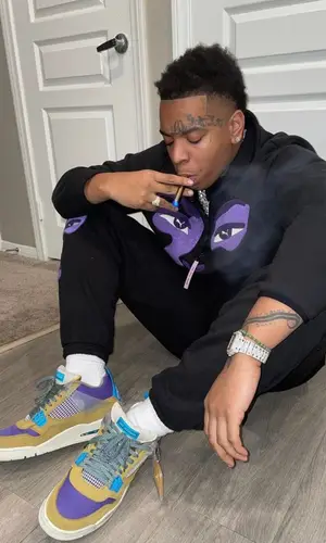 Lil Gotit’s Outfit in Puma Sweatshirt, Jordan Sneakers & KidSuper (2022)