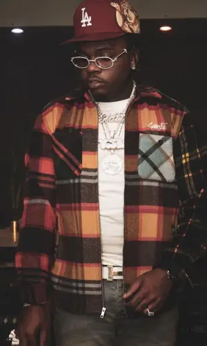 Gunna wearing Jon Stan cap