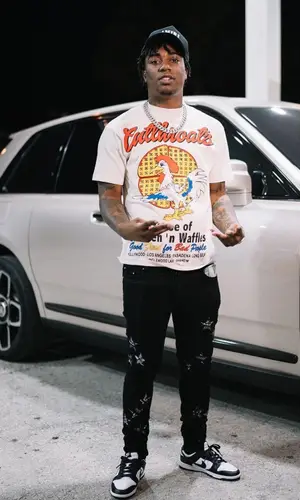 Fredo Bang wearing Amiri jeans