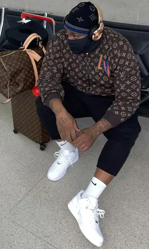 Peezy wearing Nike sock