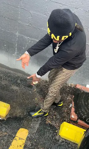 Kodak Black wearing Fendi sweatshirt