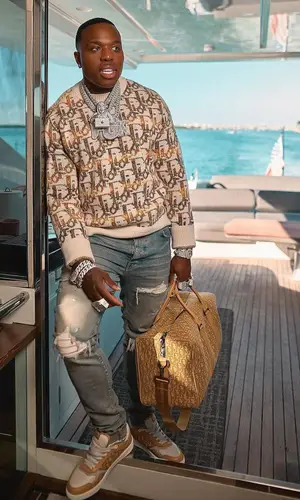 BandMan Kevo wearing Amiri jeans