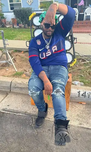Peezy wearing Nike jersey
