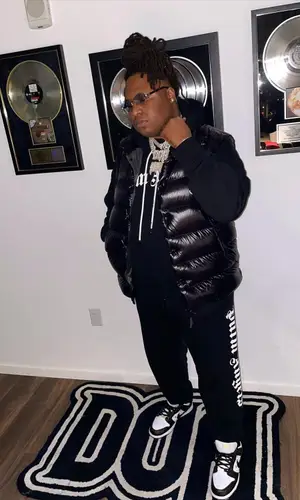 Tay Keith’s Outfit in Moncler Jacket, Palm Angels Hoodie & Cartier Eyewear (2022)