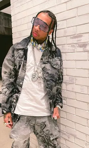 Tyga wearing Louis Vuitton belt