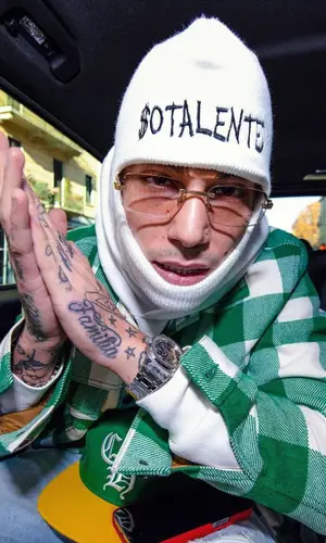 Sfera Ebbasta wearing Palm Angels shirt