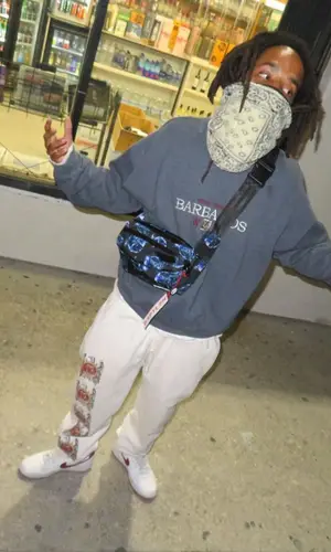 Earl Sweatshirt wearing Supreme pants