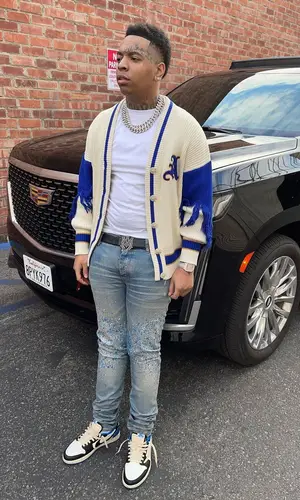 Lil Gotit wearing Amiri jeans