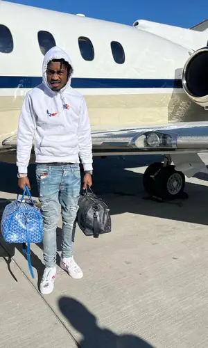 Lil Tjay wearing Goyard bag