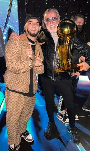 Anuel AA wearing Gucci pants