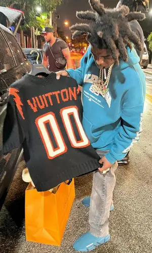 Kodak Black wearing Louis Vuitton t-shirt
