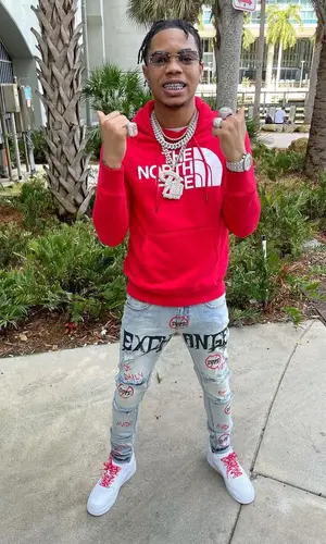 Lil Migo wearing Supreme sneakers