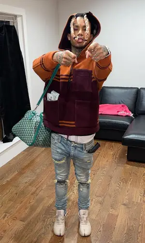Lil Gnar wearing Goyard bag