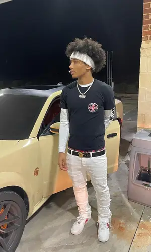 Mikey wearing Valabasas jeans