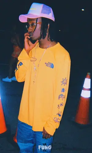 KayCyy wearing WeAr cap