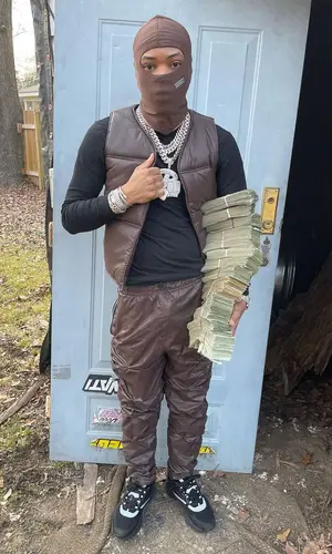 Lil Migo wearing Dior sneakers