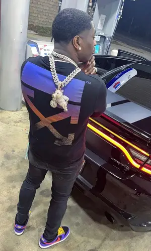 Bankroll Freddie wearing Louis Vuitton belt