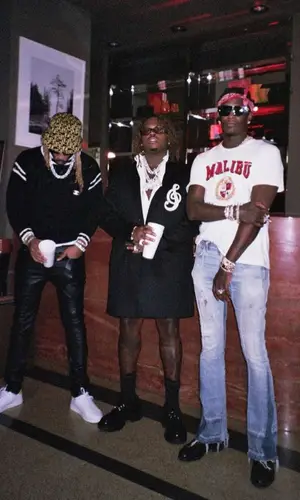Young Thug wearing Celine boots