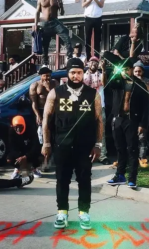 Doe Boy wearing Heron Preston cap