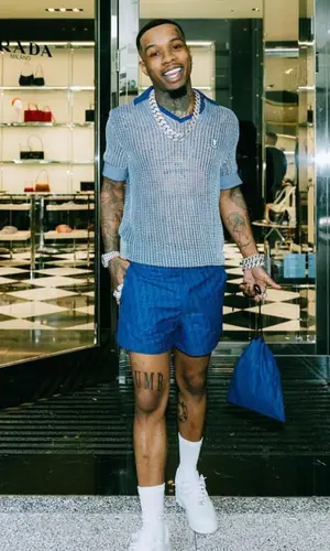 Tory Lanez wearing Dior shirt