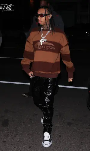 Tyga’s Outfit in Noon Goons Sweatshirt & Maison Mihara Yasuhiro Sneakers (2022)