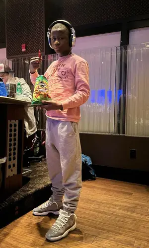 Bouba Savage’s Outfit in Human Made Shirt, Jordan Sneakers & Lil Uzi Vert Merch (2022)