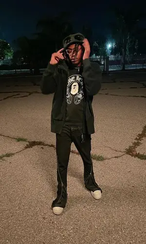 Dro Kenji wearing Bape t-shirt