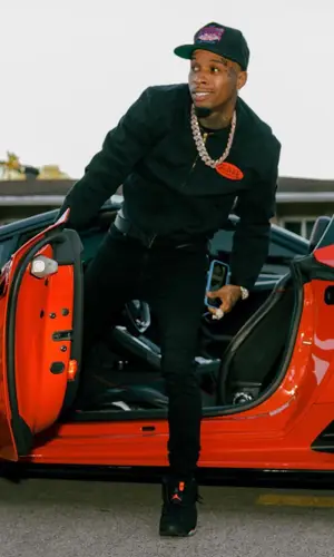 Tory Lanez wearing Rhude cap