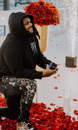 Tee Grizzley wearing Amiri jeans
