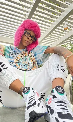 Rico Nasty wearing Adidas sneakers