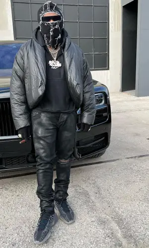 Gunna’s Outfit in Kanye West Merch Hoodie, Adidas Sneakers & Rick Owens Eyewear (2022)