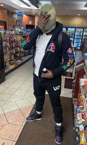 Lucki wearing Lucki Merch pants