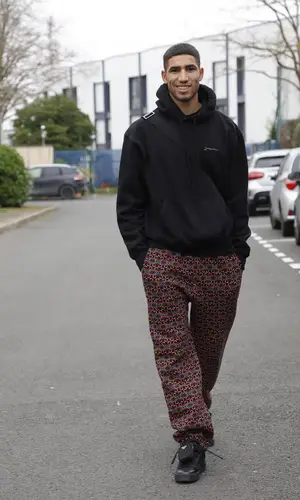 Achraf Hakimi’s Outfit in Jacquemus Hoodie, Benetton Pants & Prada Sneakers (2022)